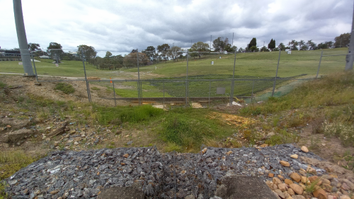 Gully with retaining wall by golf-nets